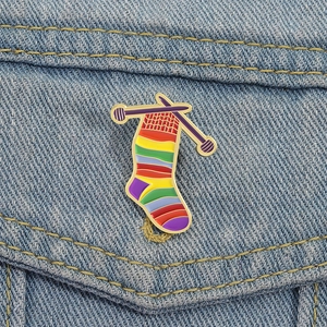 Creative colorful knitted sock enamel pin badge on denim jacket pocket for hobbyists