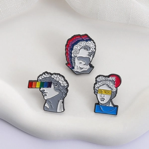 Creative retro statue enamel pins featuring classical David motifs and rainbow art accents
