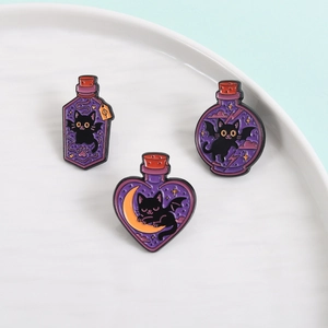 Three magic potion bottles with black cats enamel pins set on a white ceramic tray