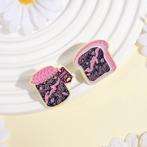 Cosmic jam and toast enamel brooch set with galaxy patterns and golden details