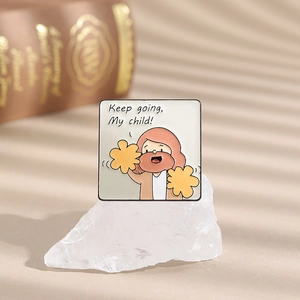 Detailed view of square enamel pin featuring cartoon Jesus and Keep going My child quote