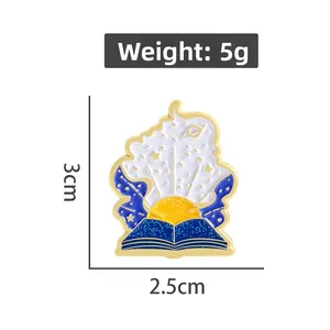 Detail view of cat book enamel pin showing 3cm by 2.5cm size and 5g weight specs