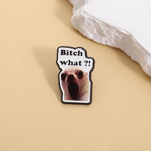 Detail view of funny chihuahua meme enamel pin with Bitch what text for backpacks