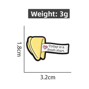 Detailed size view of fortune cookie enamel pin with Today is a fresh start text