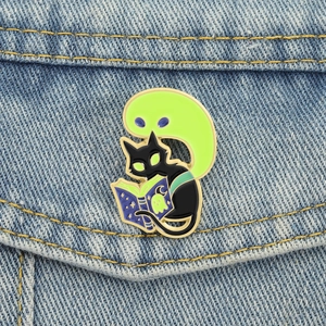 Halloween black cat reading magic book enamel pin with green ghost and glow effect