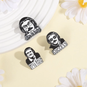 Detailed close-up of funny black and white quote character pins with zinc alloy finish