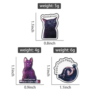 Detail view of cat enamel pins with funny English quotes on a white background