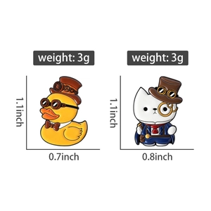 Steampunk enamel brooches detail showing vintage duck and cat pins with dimensions