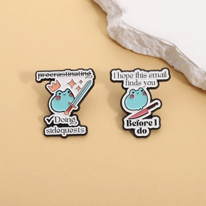 Funny blue frog enamel pins with procrastinating sidequests and humorous email quotes