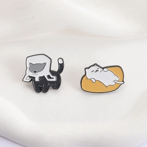 Cute lazy cat enamel pins set featuring a white cat on a cushion and a black box cat