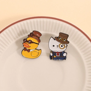 Steampunk enamel pins featuring yellow duck and white cat in vintage gears and hats