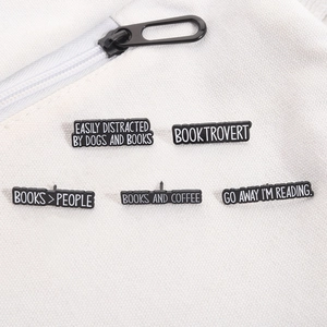 Set of 5 black enamel pins for book lovers featuring funny reading quotes on canvas