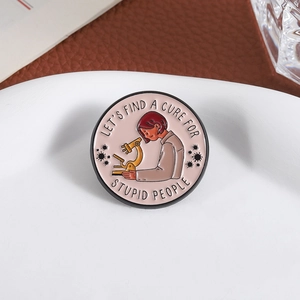Microscope enamel pin with Let's Find A Cure For Stupid People humorous quote