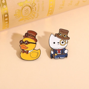 Detail of steampunk enamel pins featuring a duck in a top hat and a cat with a monocle