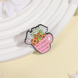 Pink coffee cup enamel pin with orange flowers and Don't forget to fill your own cup text