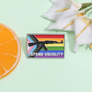 Rainbow flag lapel pin with AK-47 silhouette and Defend Equality text on green background