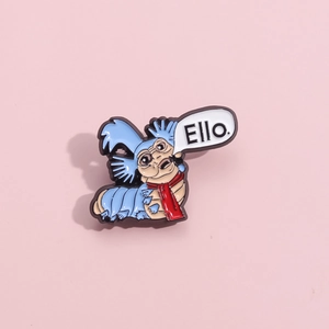 Detailed view of Ello blue monster enamel pin with red scarf from Labyrinth movie