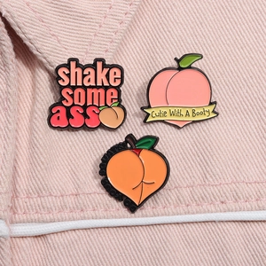 Set of 3 peach-themed enamel pins featuring humorous fitness quotes on pink denim fabric