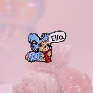 Labyrinth movie worm enamel pin with red scarf and Ello text on pink crystal base