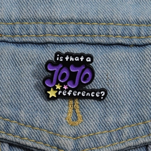 Detail of JOJO reference enamel pin with purple lettering on blue denim fabric