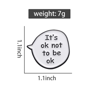 Detailed view of speech bubble enamel pin with It's ok not to be ok text and dimensions