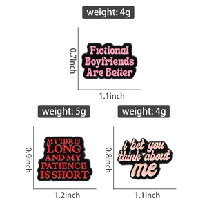 Three enamel pins with literary quotes and slogans measuring 0.7 to 1.2 inches