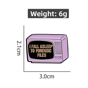 Detail view of pink vintage TV enamel pin with Forensic Files text and size dimensions