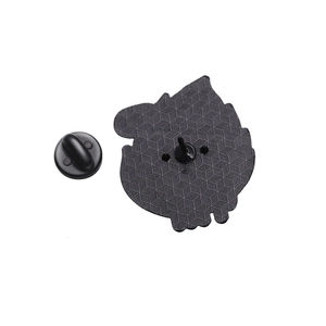 Detail view of the black enamel cat pin back with geometric texture and rubber clutch