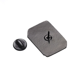 Detail view of the matte black metal base and rubber pin clutch backing for enamel pins