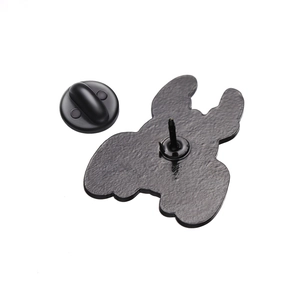 Detail view of the black metal brooch back with secure rubber butterfly clutch closure