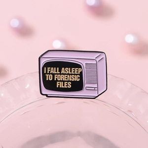 Retro pink TV enamel pin with 'I Fall Asleep to Forensic Files' text for bags and clothing
