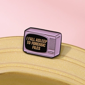 Retro lavender TV enamel pin with 'I Fall Asleep to Forensic Files' text on pink background