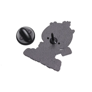 Macro view of matte black metal badge back with secure rubber butterfly clutch pin