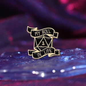 Creative enamel pin featuring a D20 dice and 'MY ROLL IN LIFE' slogan for tabletop gamers