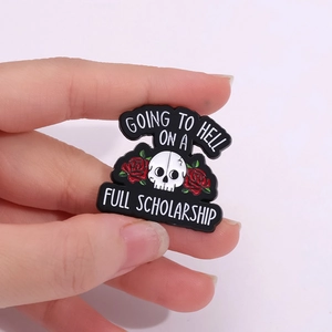 Gothic enamel pin with skull, red roses, and Going to Hell on a Full Scholarship text