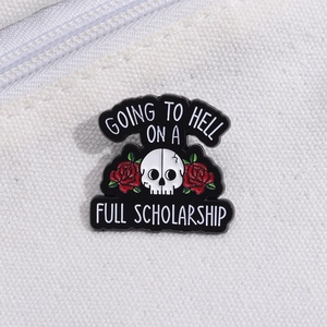 Gothic enamel pin featuring a white skull with red roses and bold text on white canvas