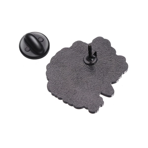 Detail view of the black rubber clutch and textured matte back of the enamel lapel pin