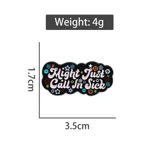 Black rectangular enamel pin with pink Might Just Call In Sick text and small floral details