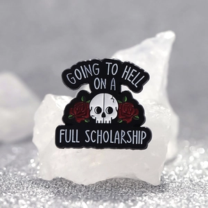 Skull and rose enamel pin with Going to Hell on a Full Scholarship text slogan
