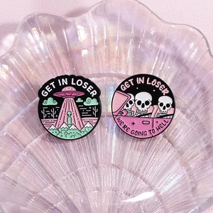 Enamel alien UFO and skeleton car brooches with humor quotes on iridescent tray