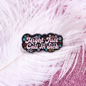 Might Just Call In Sick enamel pin with cute flowers on pink feather background