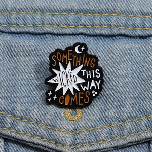 Gothic Enamel Pin with Something Wicked text on denim jacket for bag decoration
