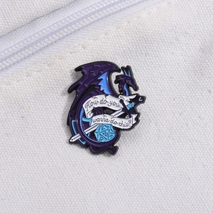Detail of fantasy dragon D20 enamel pin with sword on white canvas background