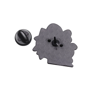 Back view of bee enamel pin with textured hexagon pattern and black rubber clutch back