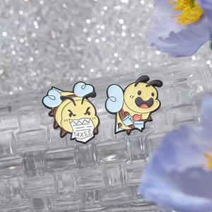 Cute cartoon bee enamel pins set with yellow body and blue wings in a gift setting