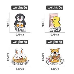 Detail of four cute cartoon animal enamel pins showing precise size and weight measurements