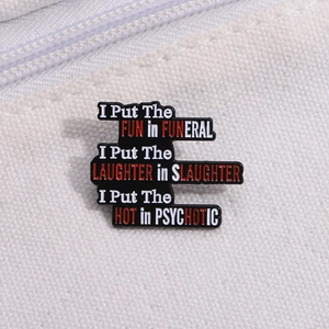 Detail of FUNERAL text enamel pin showing the glossy finish on a white canvas bag