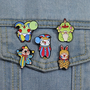 Colorful circus animal enamel pins set featuring a frog cat and seal on denim jacket