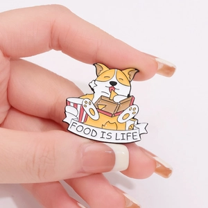 Cartoon Corgi enamel pin badge with 'FOOD IS LIFE' banner on a white background
