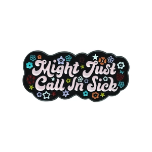 Black enamel badge with 'Might Just Call In Sick' text and colorful floral accents